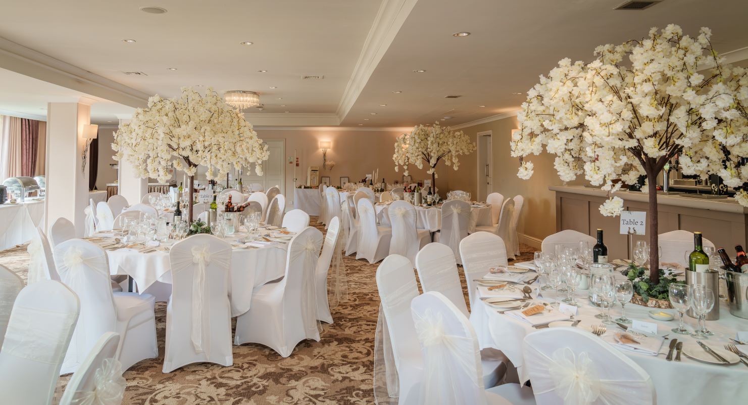 Newlyweds celebrating at The Bridge Hotel & Spa, a wedding venue in Wetherby, Yorkshire